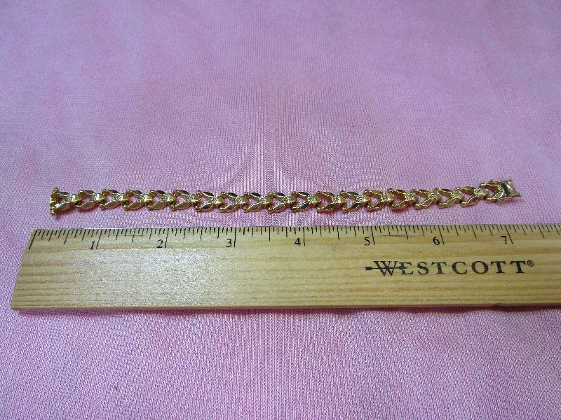 lot 157 image: 14K YELLOW GOLD AURAFIN STAMPATO 7 BRACELET, 9.5 GRAMS