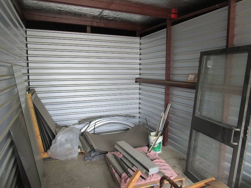 lot 20A image: Double Door Entrance wCurved Glass Overhang & Glass Wind Block & Lighted Sign