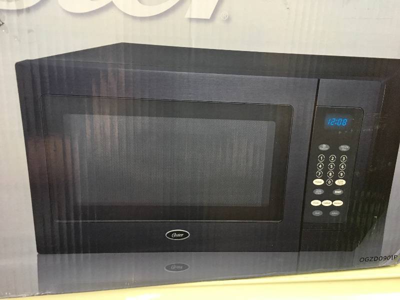 Oster .9 CUFT Black Stainless Steel Microwave Oven, Retail $54.99