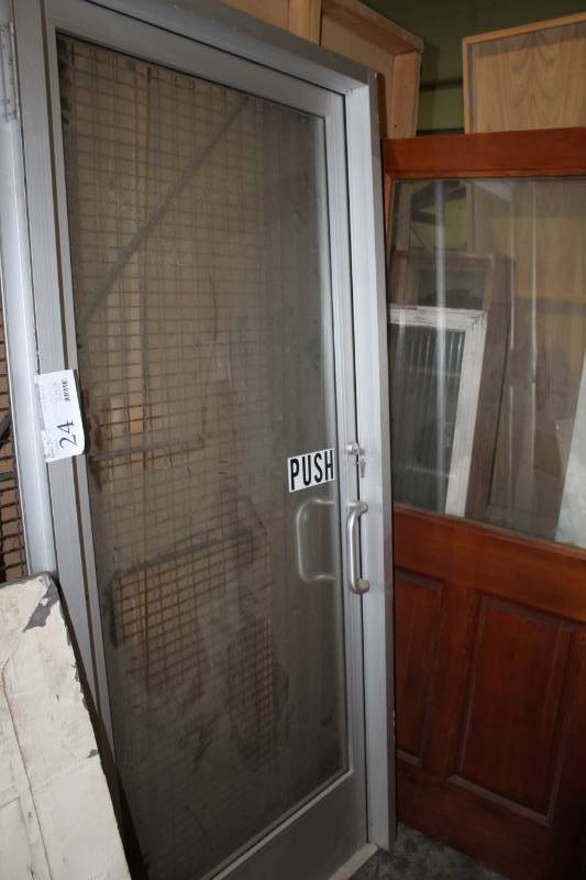 lot 24 image: Commercial Glass Panel Entry Door w Metal Frame, Metal Handles, Keys
