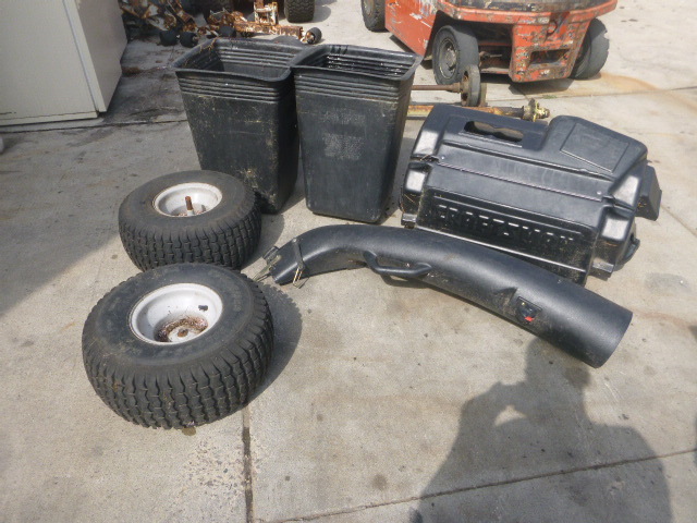 lot 11 image: 2 Lawn Mower Tires and Bagger