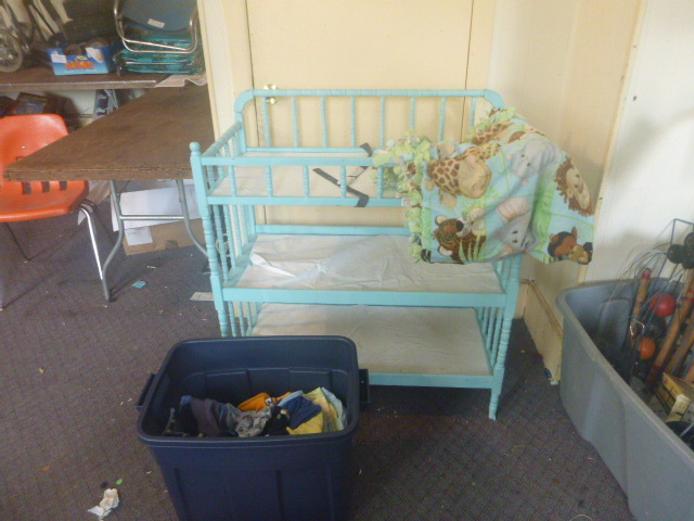 lot 7 image: Vintage Changing Table with Baby Clothes