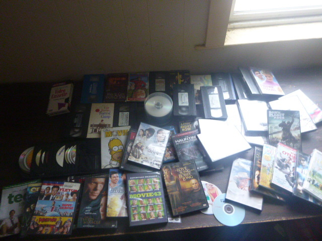 lot 34 image: Tote Full of DVD and VHS Movies