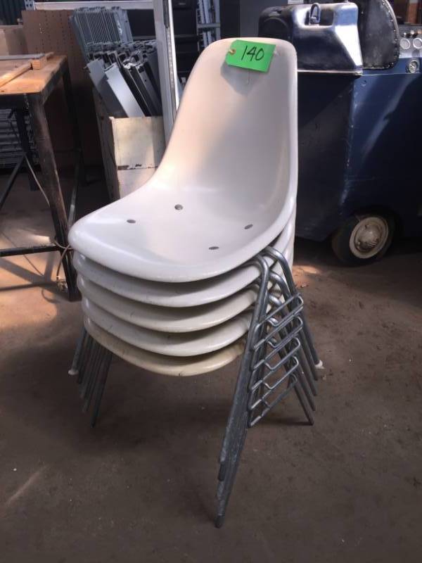lot 140 image: Mid-century Herman Miller Ivory plastic stacking bucket chairs with steel legs