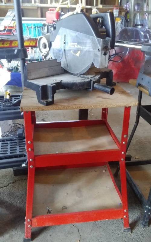 lot 14 image: Black & Decker 10 Inch Power Miter Saw With Stand 20x18x32