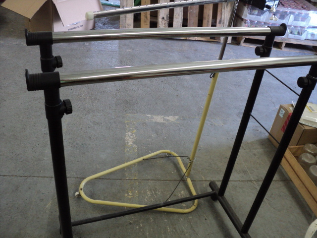 2 adjustable clothing racks...