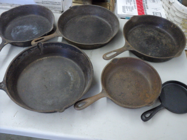 cast iron fry pans in a wood box...