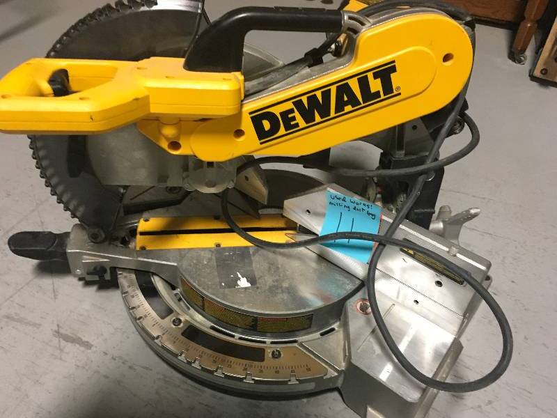 lot 11 image: DeWalt 15 Amp 12 in. Double-Bevel Compound Miter Saw Used missing dust bag in working conditions