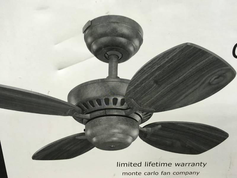 lot 90 image: 28 Colony II ceiling fan comes in a Roman Bronze finish with four teak finish blade not used