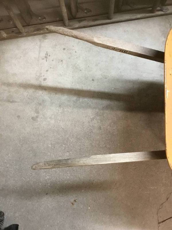 lot 33 image: Yellow Steel Wheel Barrow - Tire holds air - May need new handles soon - with a Craftsman Bag and Chute