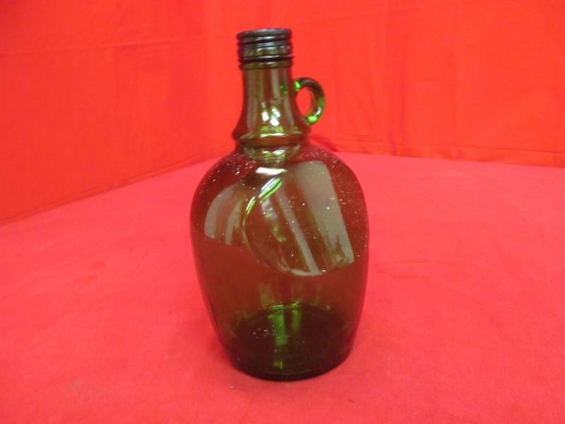 lot 27 image: vintage green glass jug