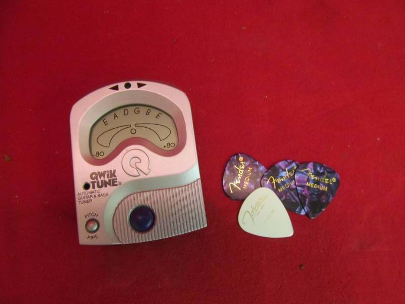 lot 113 image: Fender Guitar picks , tuner