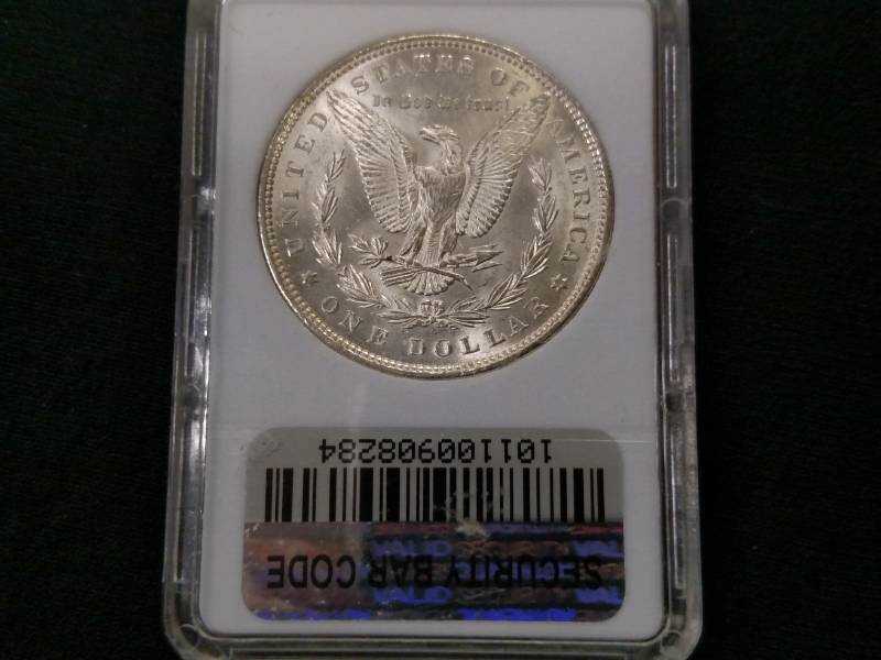 lot 9 image: 1886 MS66 Morgan Silver Dollar...