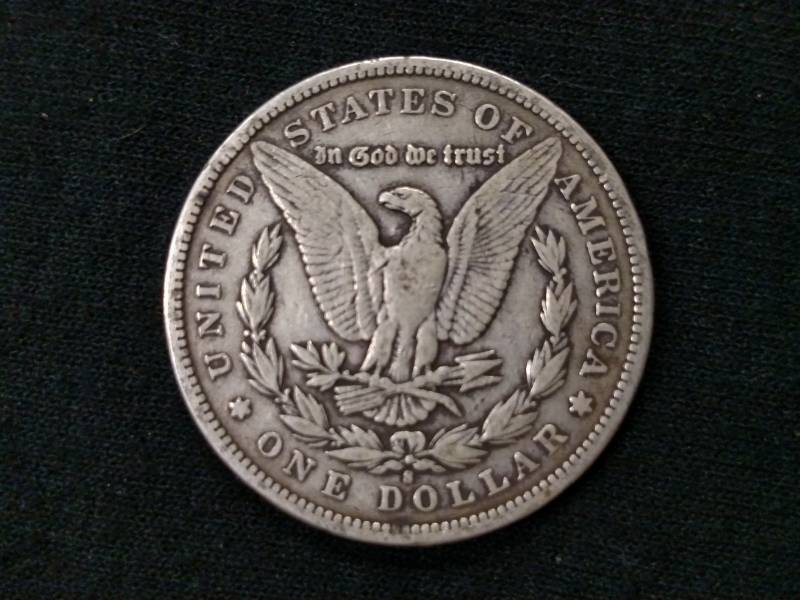 lot 10 image: 97 S Morgan Silver Dollar...