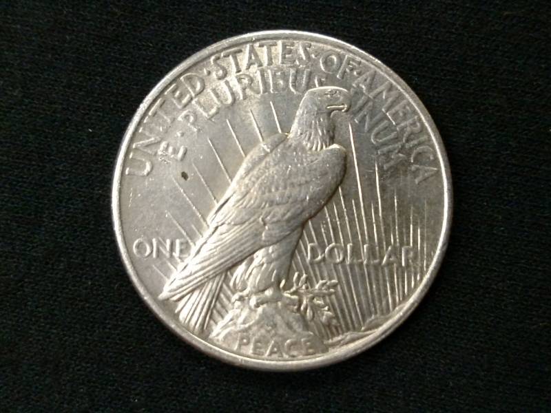 lot 24 image: 1925 Peace Silver Dollar...