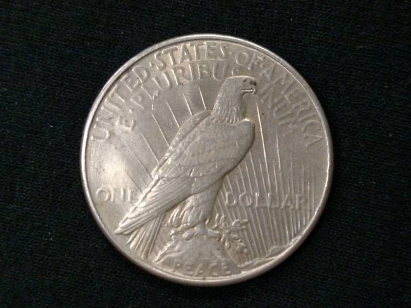 lot 28 image: 1935 Morgan Silver Dollar...