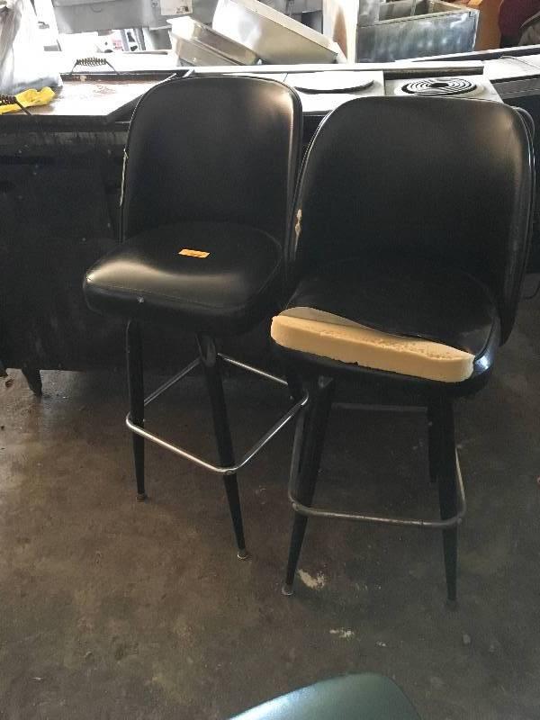lot 15 image: Two Black Swivel Chairs Barstools