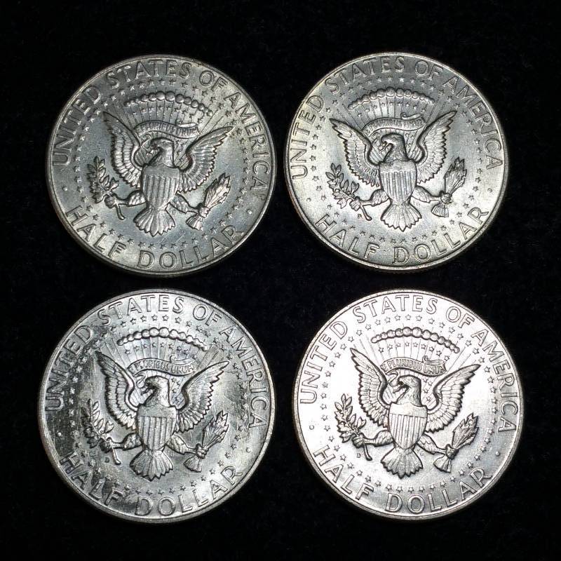 lot 34 image: (4) 1964 Kennedy Half Silver Dollars