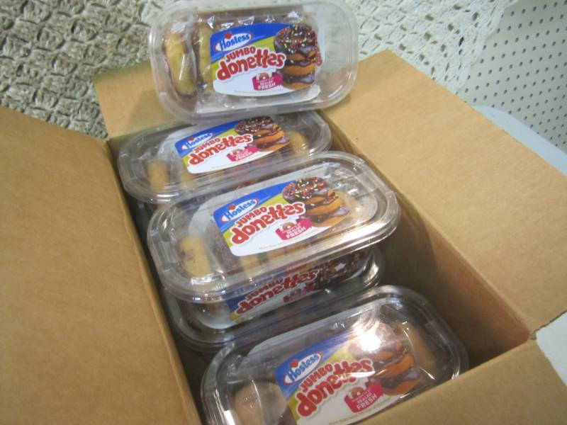 lot 87 image: Case of Jumbo Chocolate Iced Cake D...