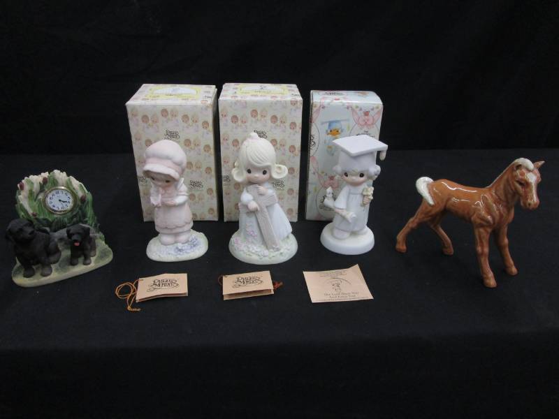 lot 84 image: Precious Moments We are Gods Workmanship, I believe in the old rugged cross, The Lord bless you and keep you plus Dog clock and horse