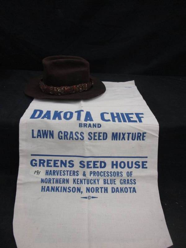 lot 108 image: Dokata Chief lawn grassseed Bag, and a Hat