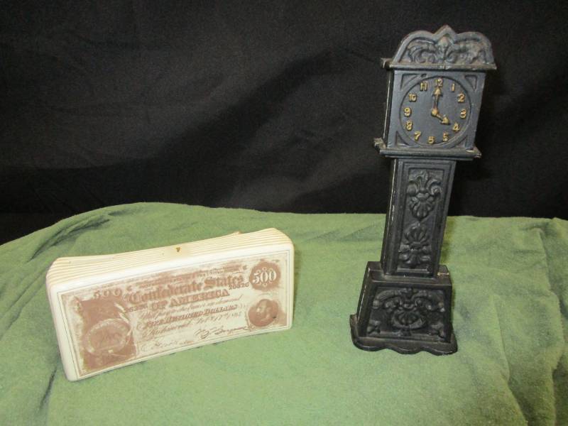 lot 123 image: Cast Iron Clock bank and money bank