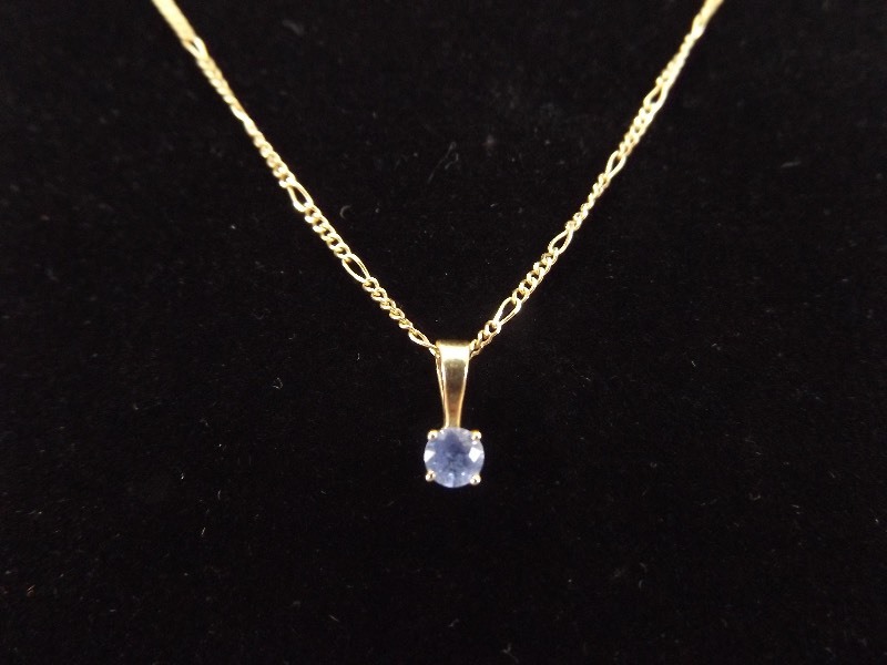 lot 32 image: Rogers and Hollands 14k Yellow Gold Necklace and Blue Topaz Pendant