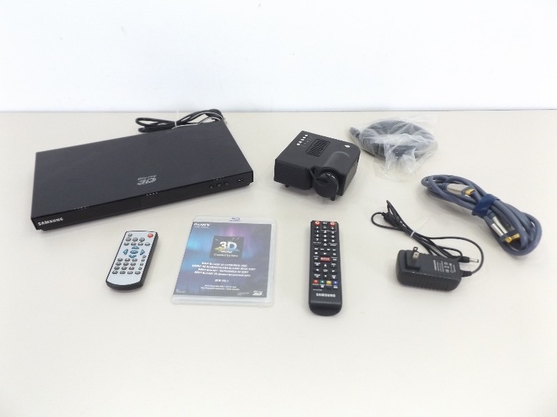 lot 63 image: WORKING Samsung 3D Blu Ray, Mini Projector, and Extras