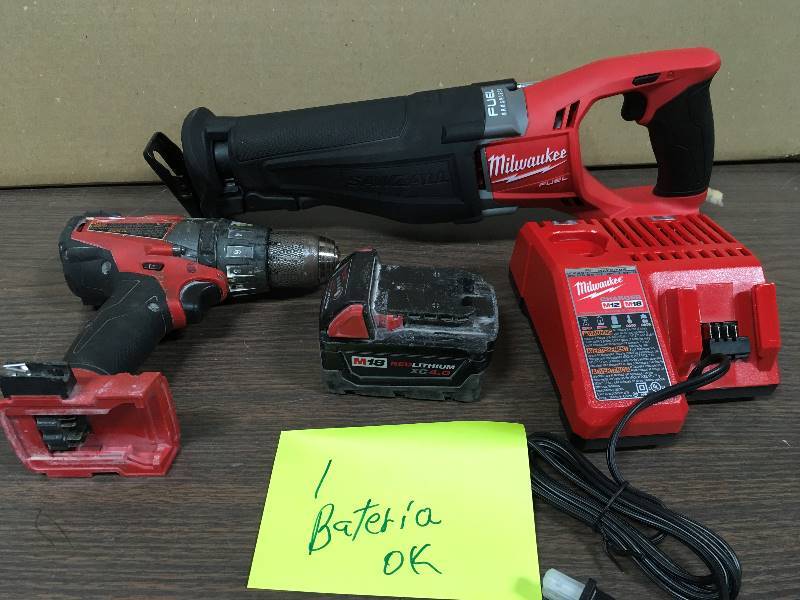 lot 19 image: Milwaukee Drill and Milwaukee M18 FUEL 18-Volt Lithium-Ion Brushless Cordless SAWZALL Reciprocating Saw with one battery and charger used in working condition
