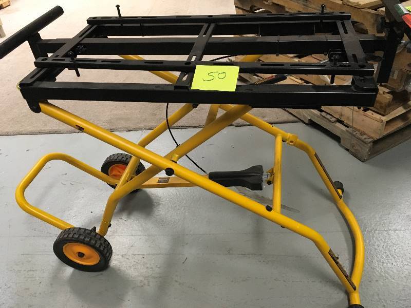 lot 50 image: Dewalt Miter Saw Stand - cable needs to be replaced - does not fold down in good condition