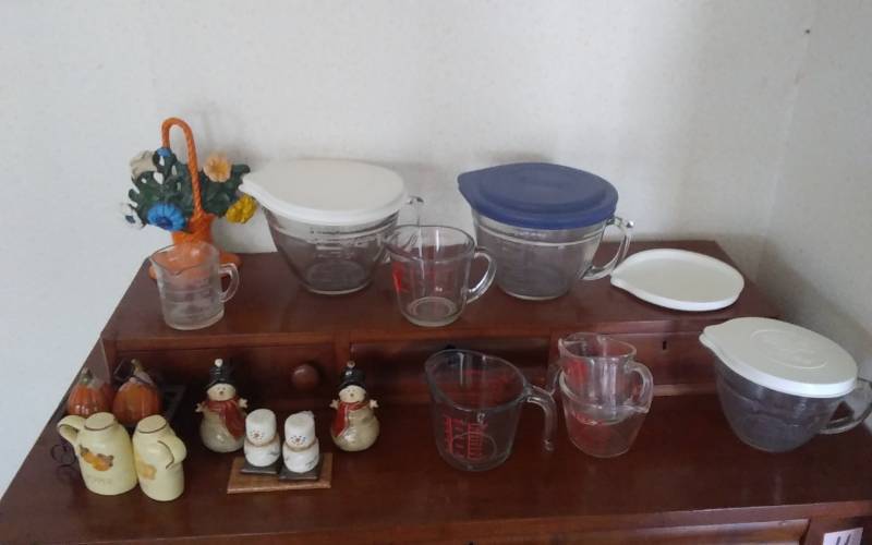 lot 18 image: Cast Iron Flower Basket Door Stop, Pyrex Mixing & Measure, Salt & Peppers
