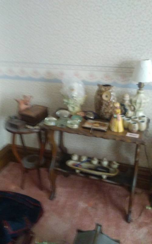 lot 55 image: 2-Small Parlor Tables, Lot Of Collectibles, Paper Weights, Figurines, German Decanter Bring Boxes For Loading