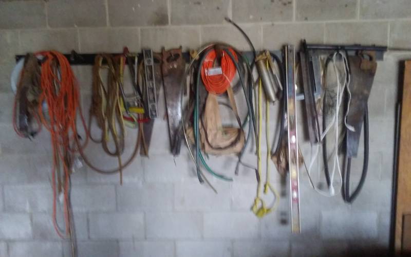 lot 87 image: Contents Pictured Extension Cords, Come Alongs, Saws, Levels, Squares, More