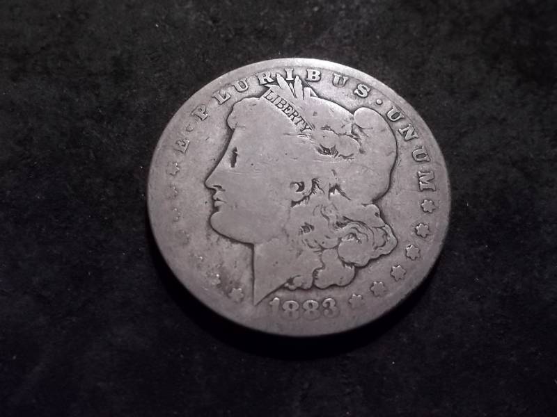 lot 5 image: 1883 CC Morgan Silver Dollar