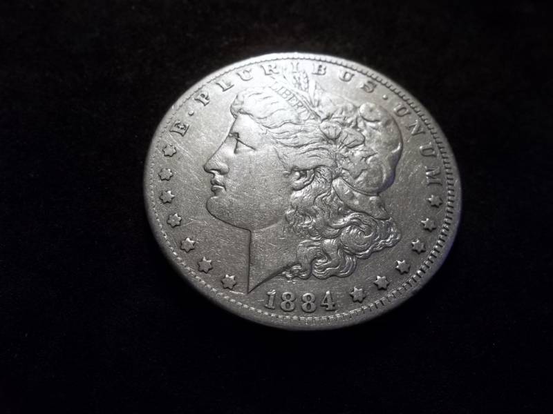 lot 6 image: 1884 CC Morgan Silver Dollar