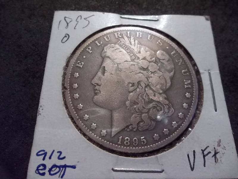 lot 14 image: 1895 O Morgan Silver Dollar