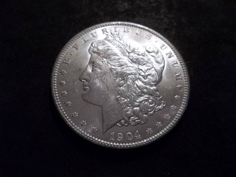 lot 22 image: 1904 O Morgan Silver Dollar