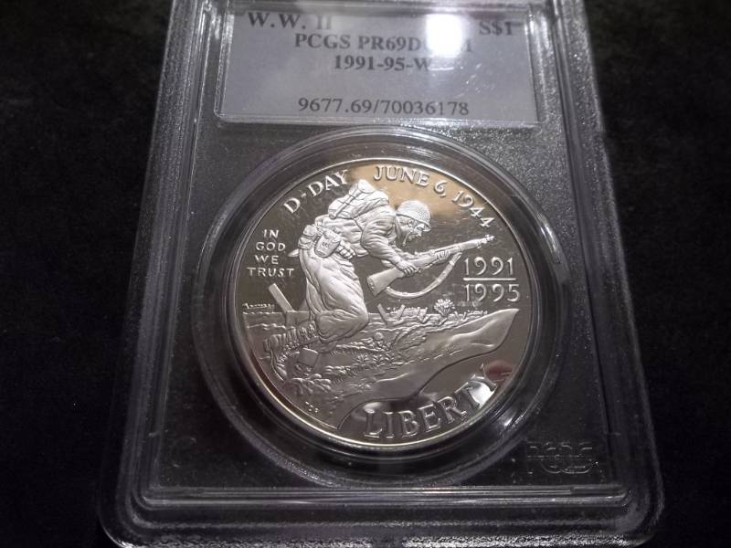 lot 34 image: WW II D-Day 1991-95 W Commemoratve Silver Dollar