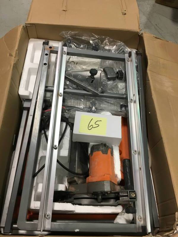 lot 65 image: RIDGID 7 in. Tile Saw with Stand  Used in good working cond.