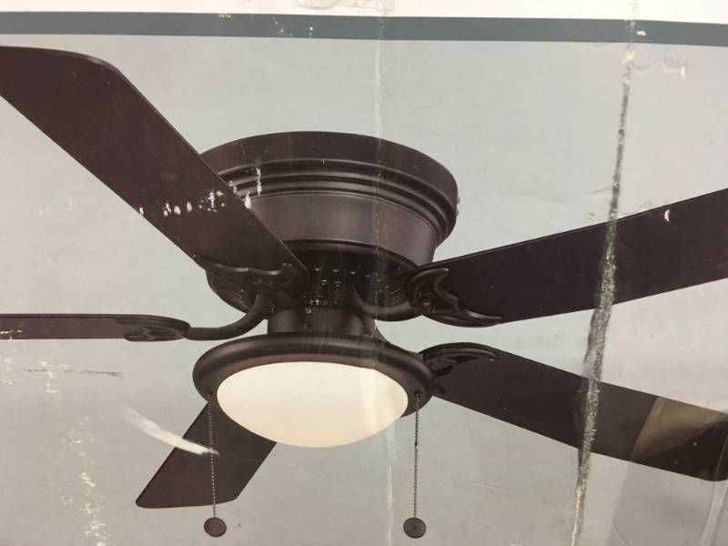 lot 83 image: Hampton Bay Hugger 52 in. Black Ceiling Fan  Black  Reversable Blades in good conditions