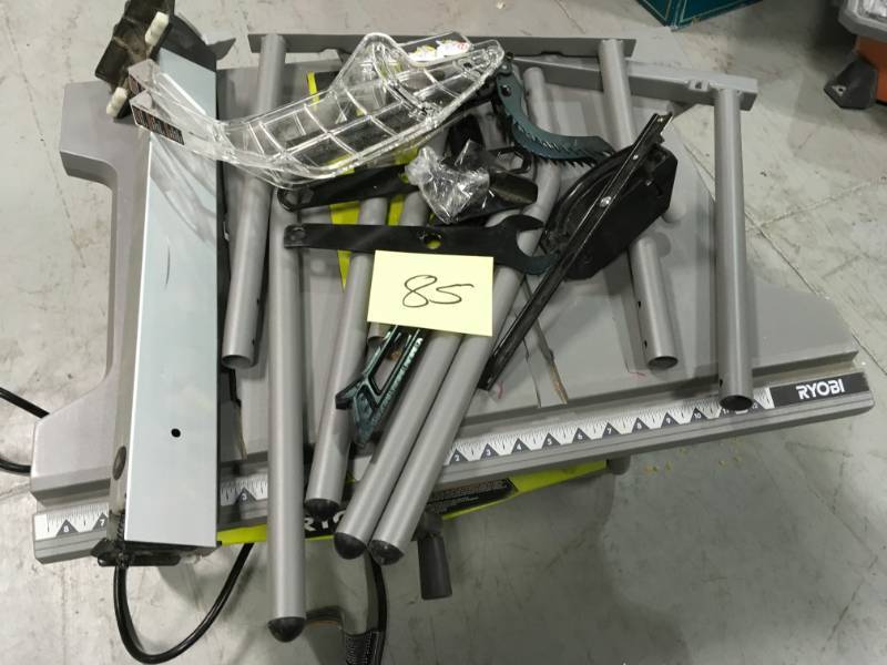 lot 85 image: RYOBI 10 in. Table Saw with Folding Stand  Used in good working cond.