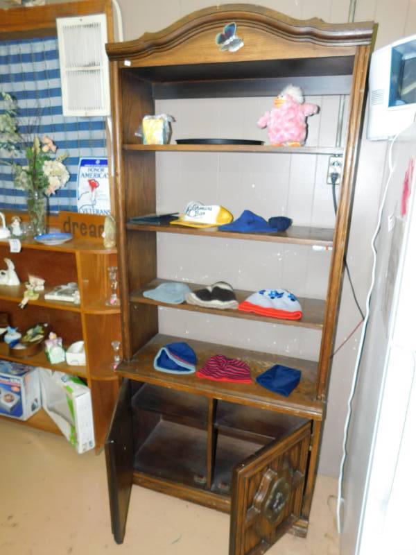 lot 13 image: A Wood Shelving Unit With Three Shelves On Top And Two Doors On The Bottom  & All Contents