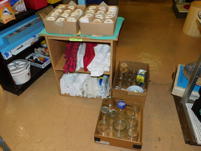 lot 101 image: Twenty Three Coffee Cups, Table Cloths  Shelf UnitTwo Boxes Of Jars
