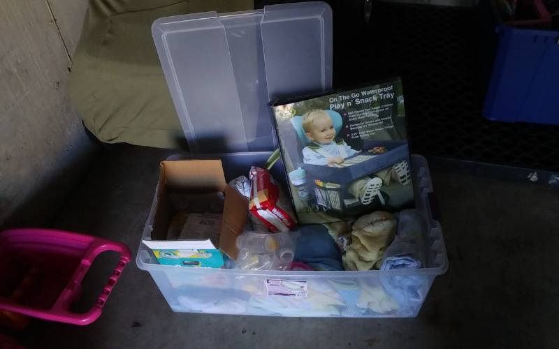 lot 34 image: Tote Bin With Lid Full Of Baby Related (Bottles, Blankets, Clothing, Snack Tray)