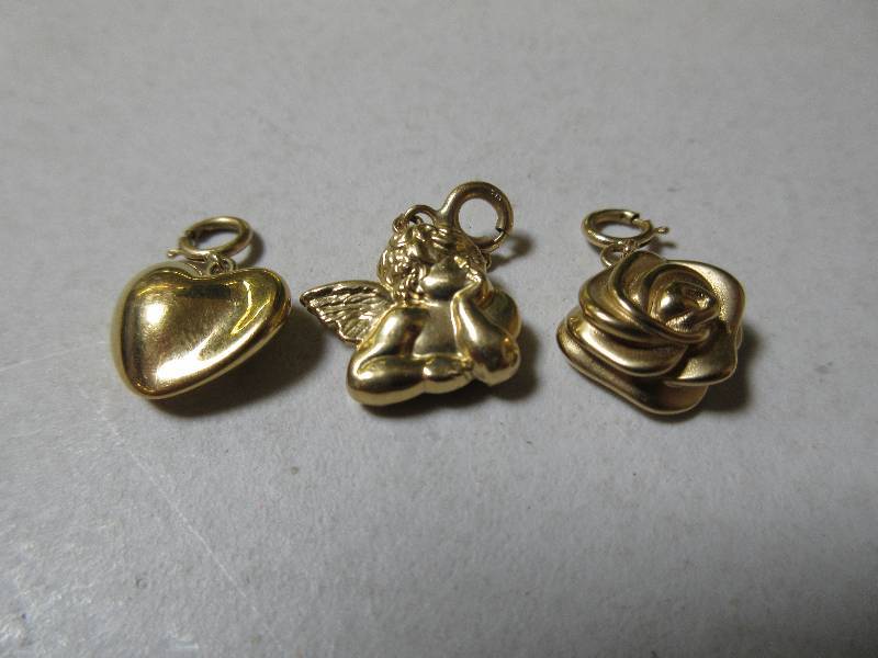 THREE 14K YELLOW GOLD CHARMS