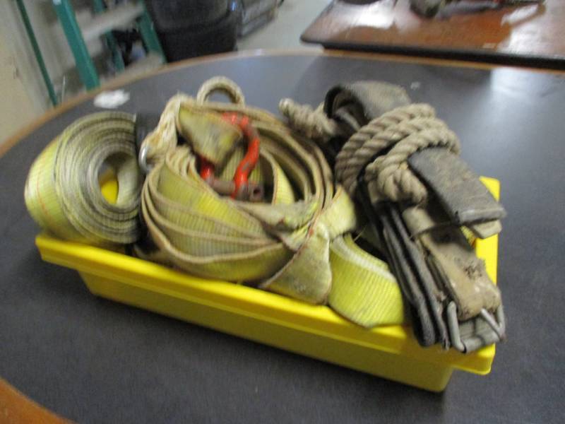 Box of tie downs and tow straps