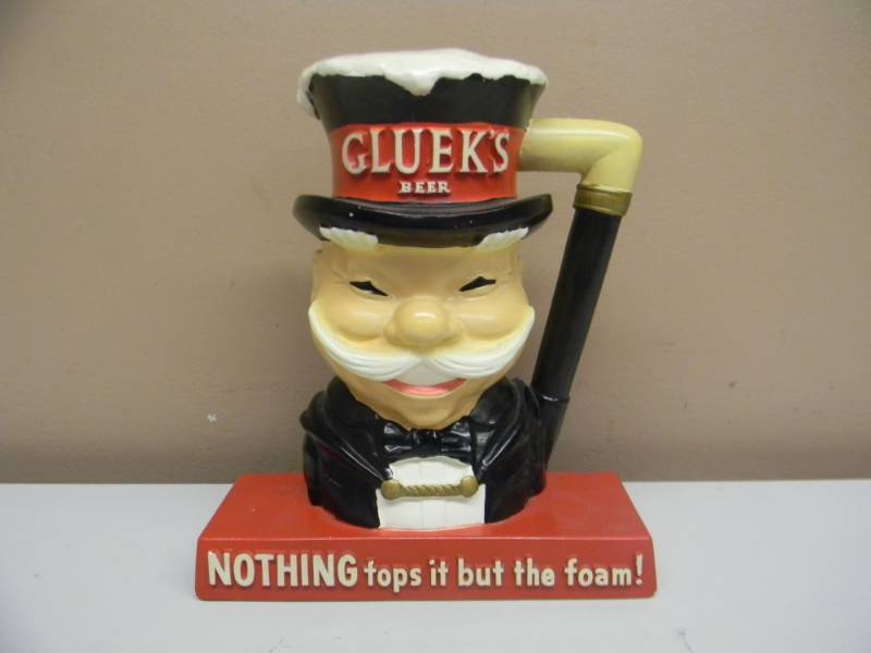 lot 35 image: VERY NICE GLUEKS BEER CHALKWARE STATUE - APPROX 8 BY 9 - SEE PICTURES
