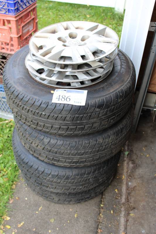 Lot of (4) Prime Well PS850 P21570R15 Tires w 5-Lug Steel Wheels, Dodge Hubcaps