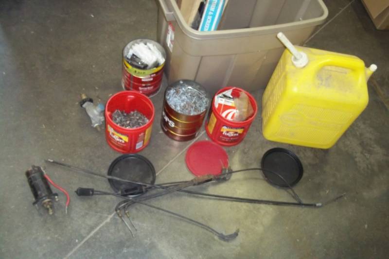 lot 32 image: Nails, Starter, Regulator, yellow gas can, Bearing seals, and parts