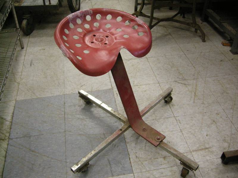 lot 101 image: Vintage Tractor Seat Rolling Stool